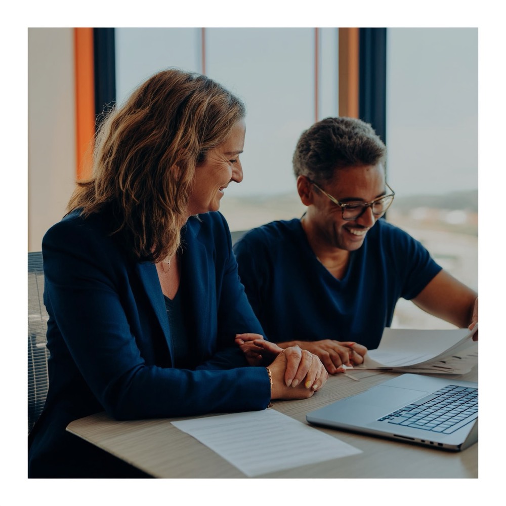 Real estate trainer giving one-to-one support to a student